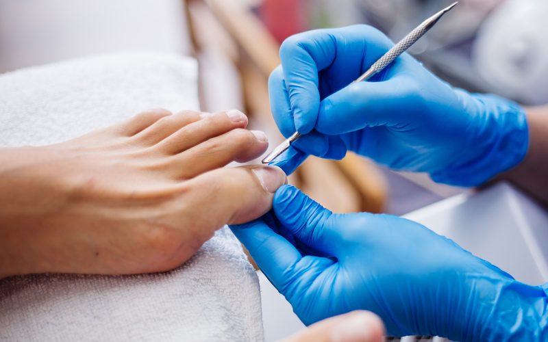 pedicure-process-home-salon-pedicure-foot-care-treatment-nail-process-professional-pedicures-master-blue-gloves-make-pedicure